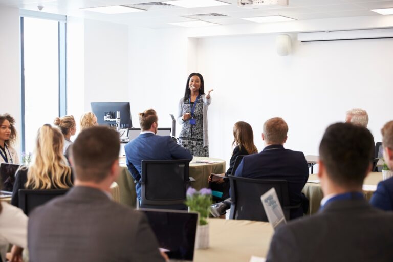 Businesswoman Making Presentation At Conference